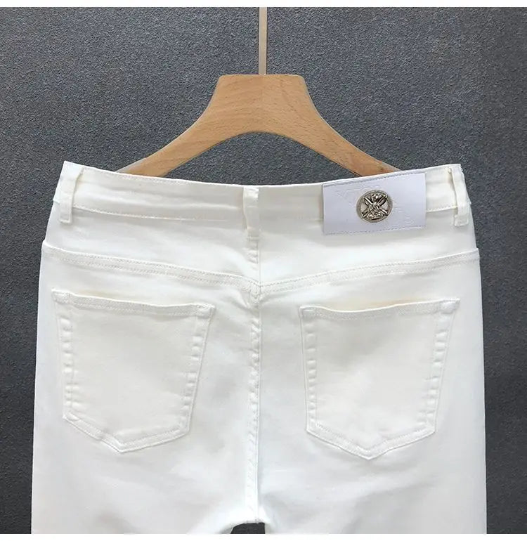 Vaqueros ajustados de estilo coreano de alta calidad para hombre, de estilo urbano, para primavera y otoño, con tela vaquera y pantalones casuales punk en blanco y negro liso.