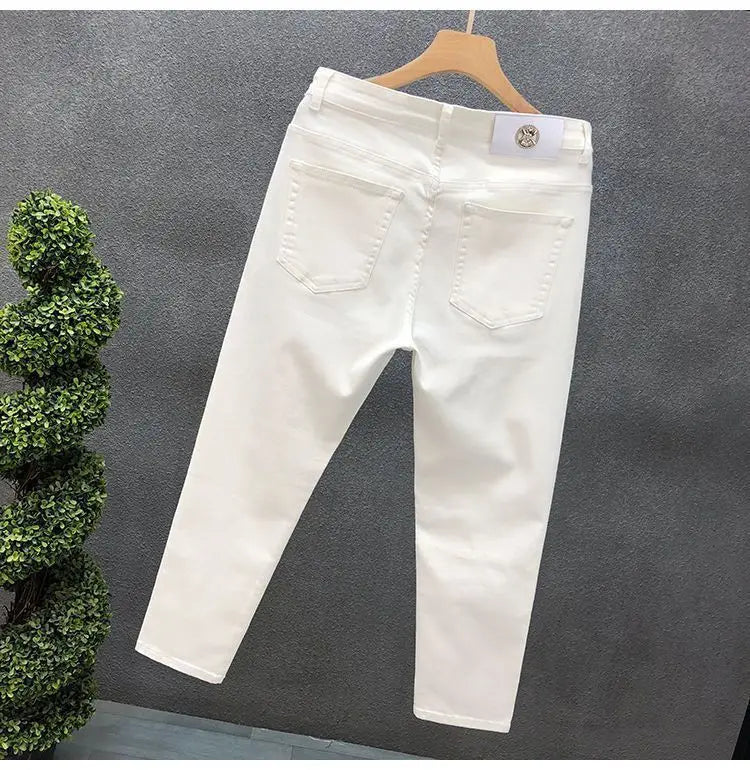 Vaqueros ajustados de estilo coreano de alta calidad para hombre, de estilo urbano, para primavera y otoño, con tela vaquera y pantalones casuales punk en blanco y negro liso.