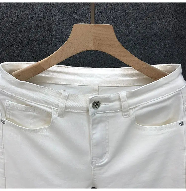 Vaqueros ajustados de estilo coreano de alta calidad para hombre, de estilo urbano, para primavera y otoño, con tela vaquera y pantalones casuales punk en blanco y negro liso.