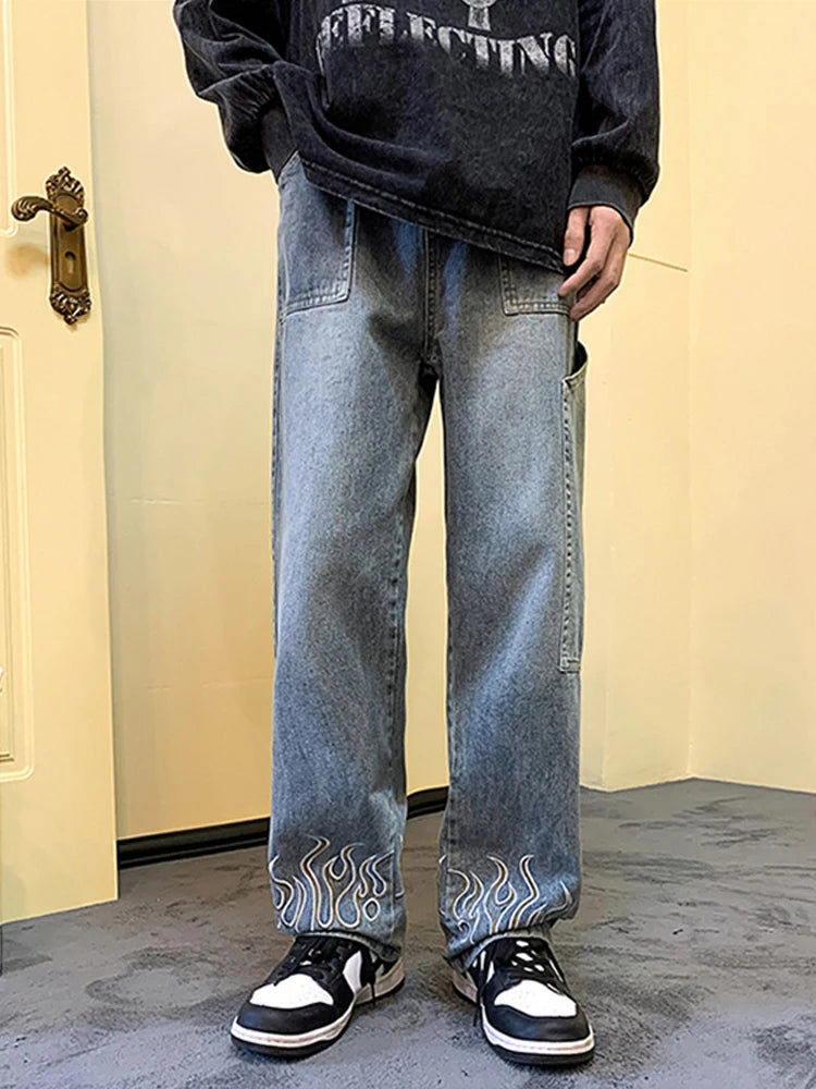 Pantalones vaqueros vintage con estampado de llamas Y2K para hombre, pantalones vaqueros holgados de pierna ancha, pantalones vaqueros rectos de moda hip hop 2025.