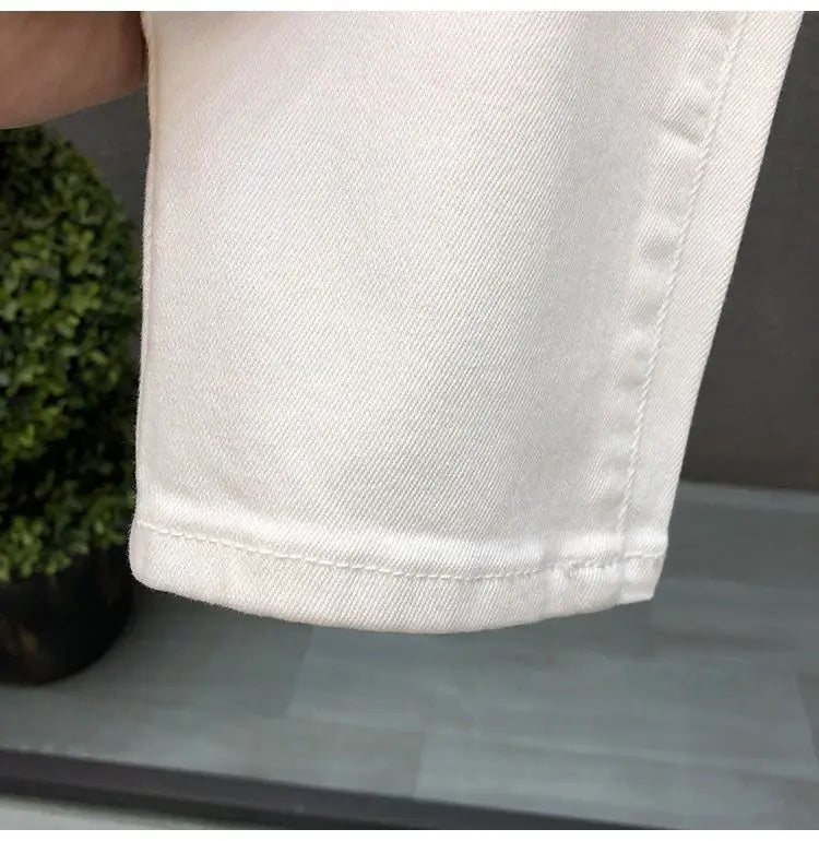 Vaqueros ajustados de estilo coreano de alta calidad para hombre, de estilo urbano, para primavera y otoño, con tela vaquera y pantalones casuales punk en blanco y negro liso.