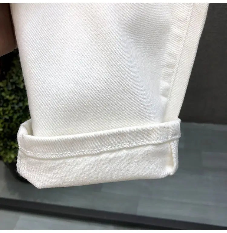 Vaqueros ajustados de estilo coreano de alta calidad para hombre, de estilo urbano, para primavera y otoño, con tela vaquera y pantalones casuales punk en blanco y negro liso.