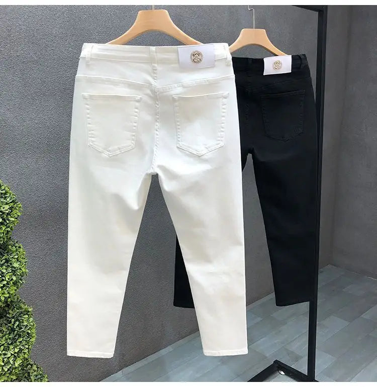 Vaqueros ajustados de estilo coreano de alta calidad para hombre, de estilo urbano, para primavera y otoño, con tela vaquera y pantalones casuales punk en blanco y negro liso.