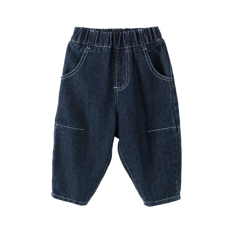 Pantalones vaqueros de color liso de estilo moderno para niños, nuevos, casuales y versátiles, vaqueros elásticos y sueltos para bebés.