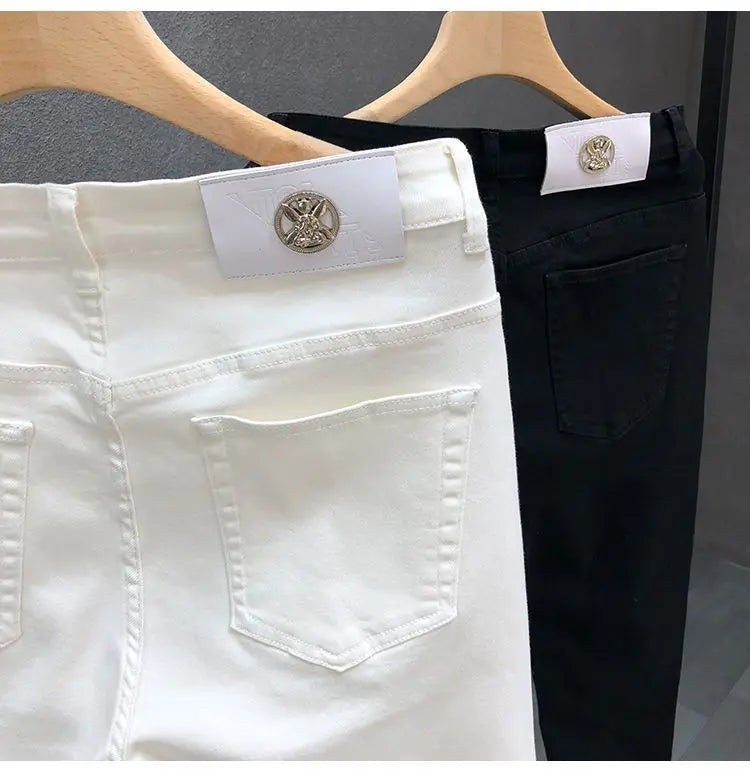 Vaqueros ajustados de estilo coreano de alta calidad para hombre, de estilo urbano, para primavera y otoño, con tela vaquera y pantalones casuales punk en blanco y negro liso.